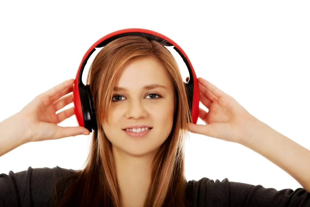 Teenage woman listening to music